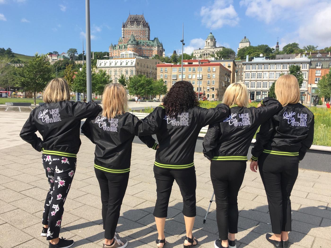 Our team members from the back showing off their QDa jackets