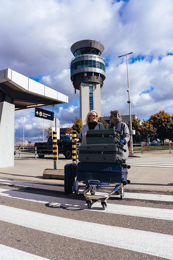 Departure of two happy tourists at Quebec City Airport