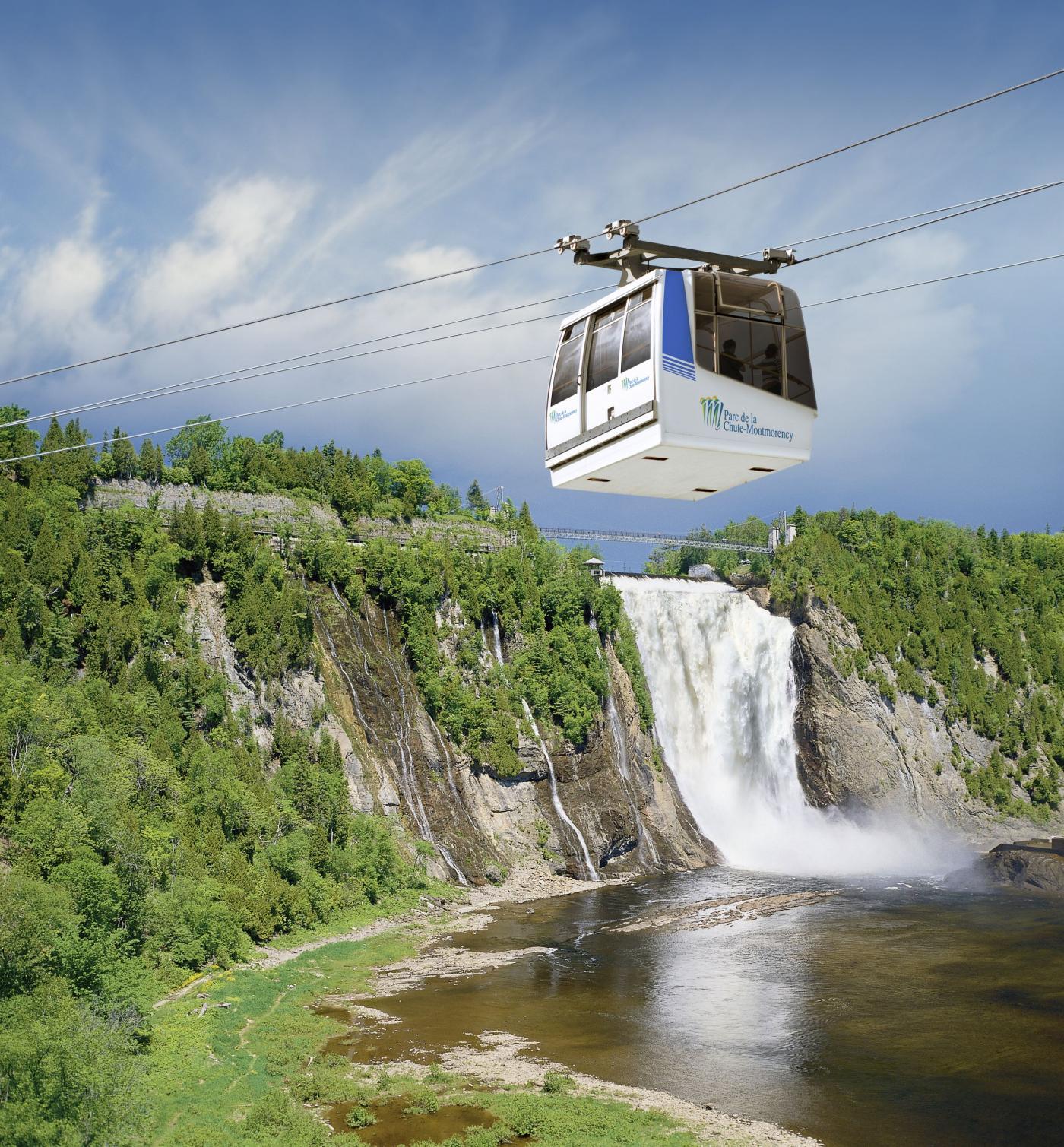 The Parc de la Chute-Montmorency cable car with the view of the waterfall in the background.