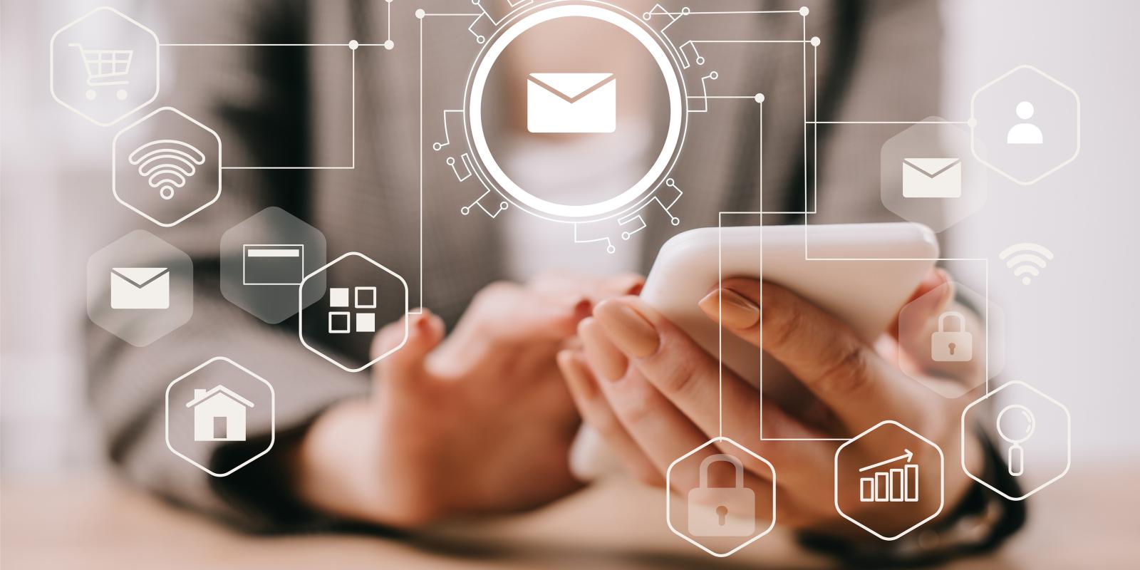 Close-up of a person using a smartphone, with digital email icons representing email marketing and online communication